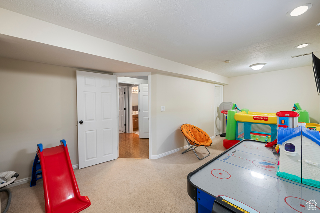 Playroom with carpet and baseboards