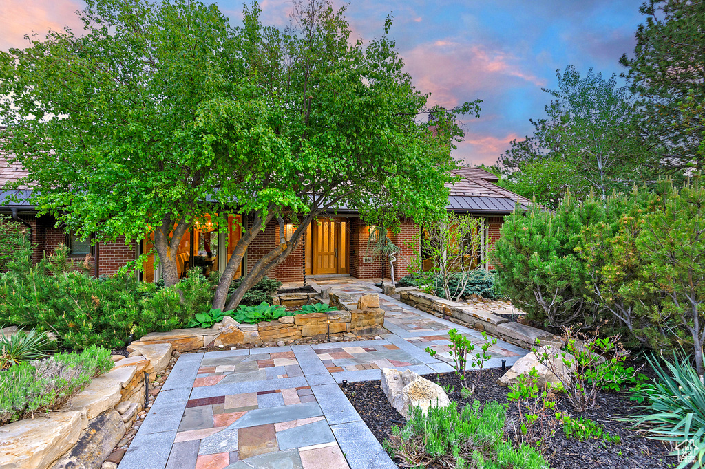 View of front of home featuring brick siding