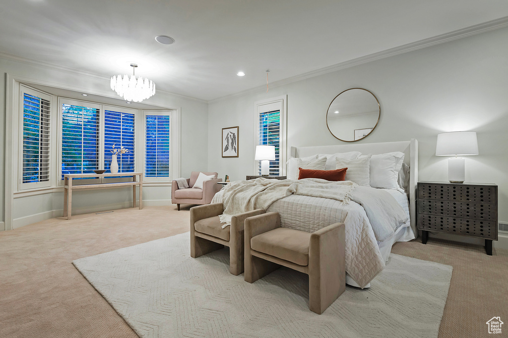 Carpeted bedroom featuring ornamental molding, a chandelier, recessed lighting, and baseboards
