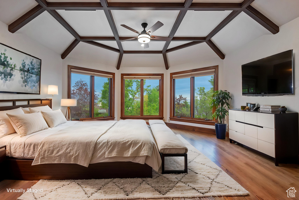 Bedroom with light wood-type flooring and multiple windows