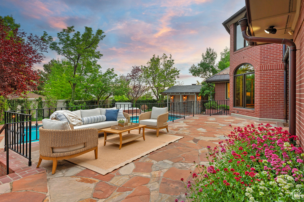 Fenced backyard with outdoor lounge area and a patio area