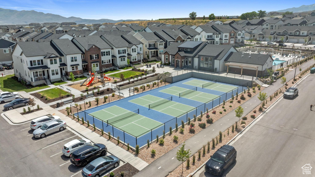 Aerial view of residential area with a mountainous background