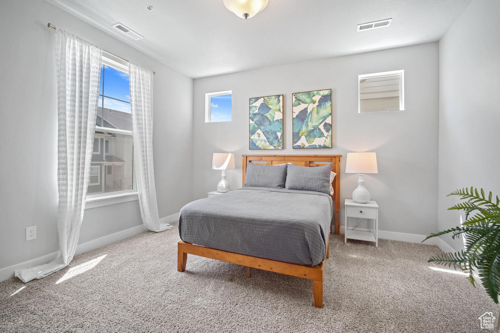 Carpeted bedroom with baseboards