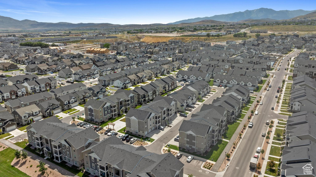 Aerial overview of property's location with mountains and nearby suburban area