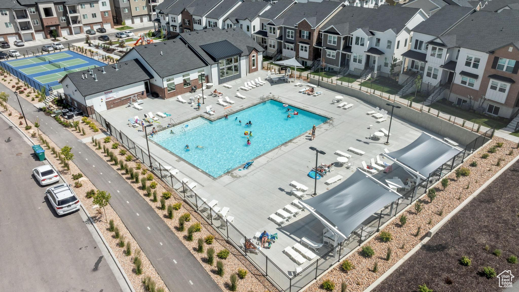Aerial view of residential area featuring a pool