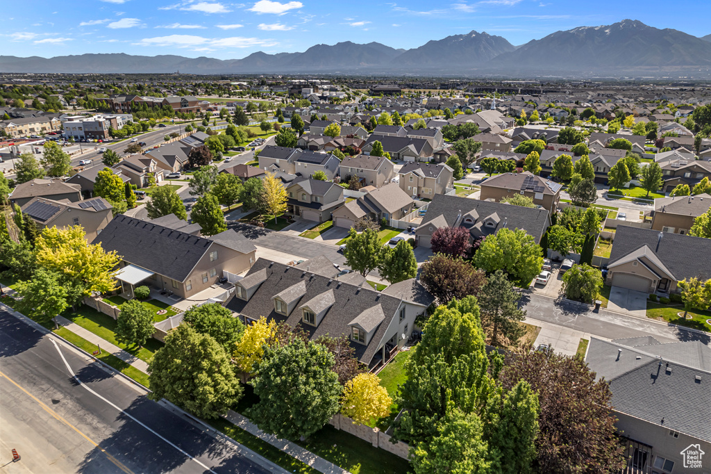 Aerial perspective of suburban area with a mountain backdrop