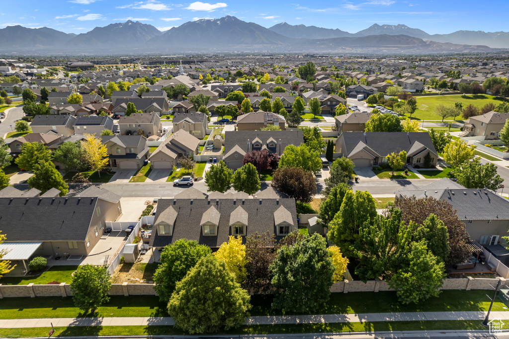 Aerial view of residential area with a mountain backdrop