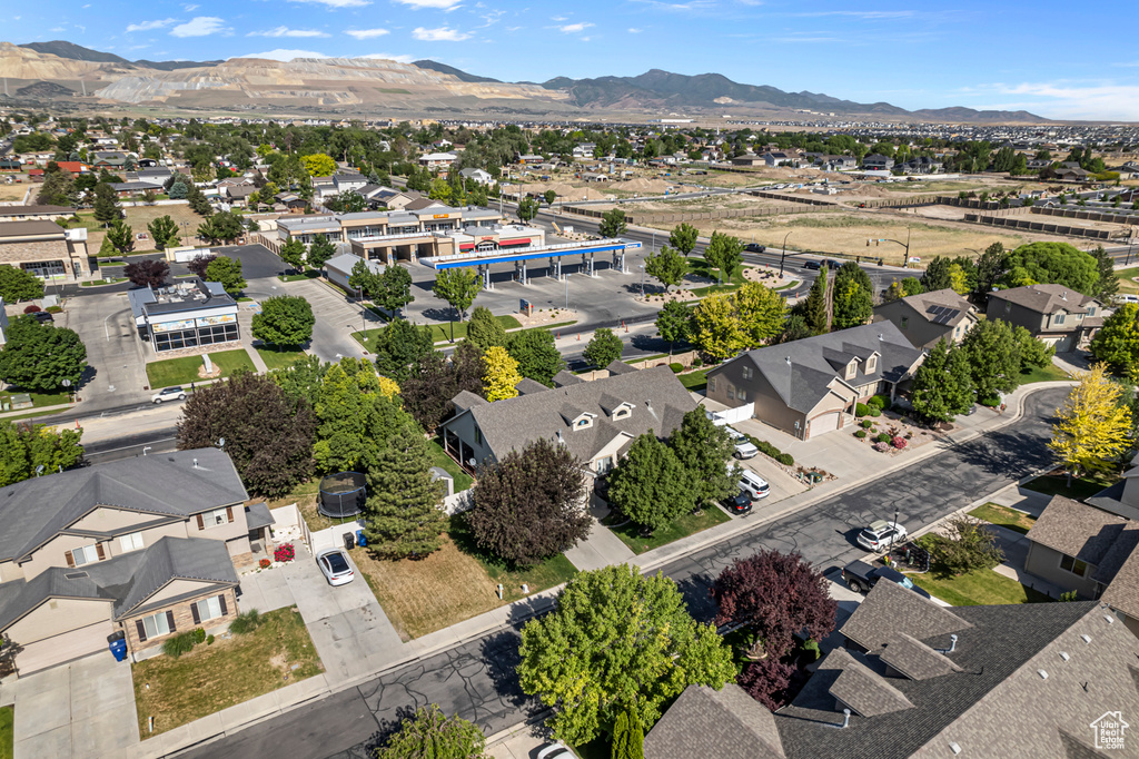 Aerial perspective of suburban area with a mountainous background