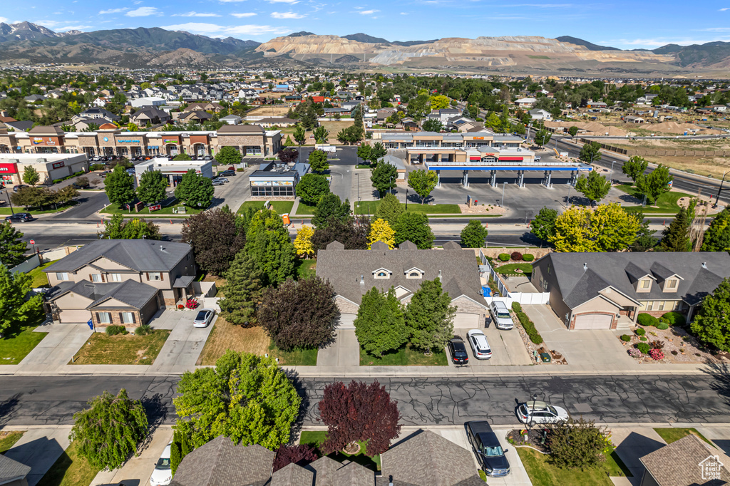 Aerial view of residential area featuring a mountainous background