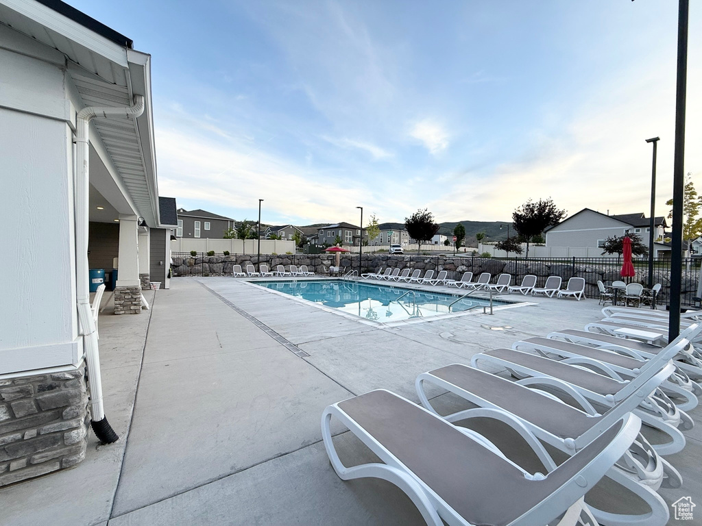 Community pool featuring a patio