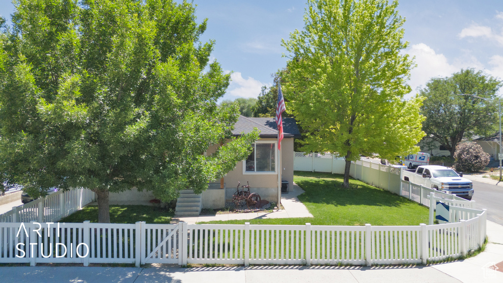 Obstructed view of property with a shingled roof