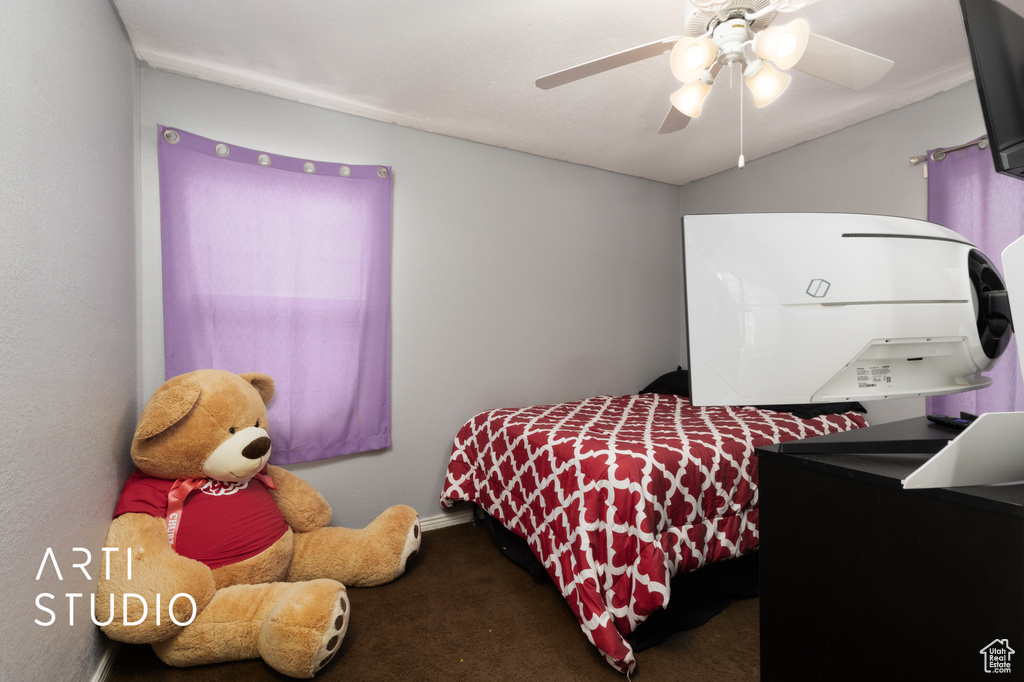 Bedroom with carpet flooring and a ceiling fan