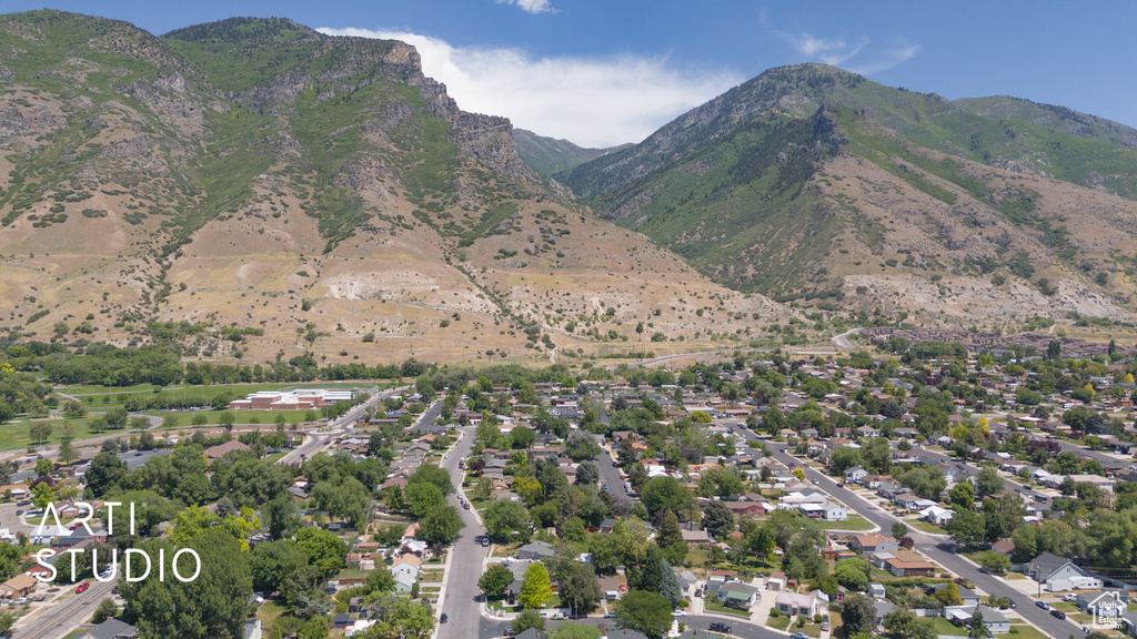 Aerial overview of property's location with a mountainous background
