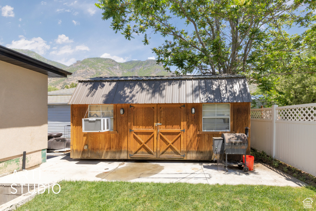 View of outbuilding featuring a mountain view and cooling unit
