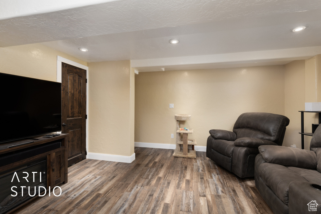 Sitting room featuring wood finished floors, baseboards, and recessed lighting