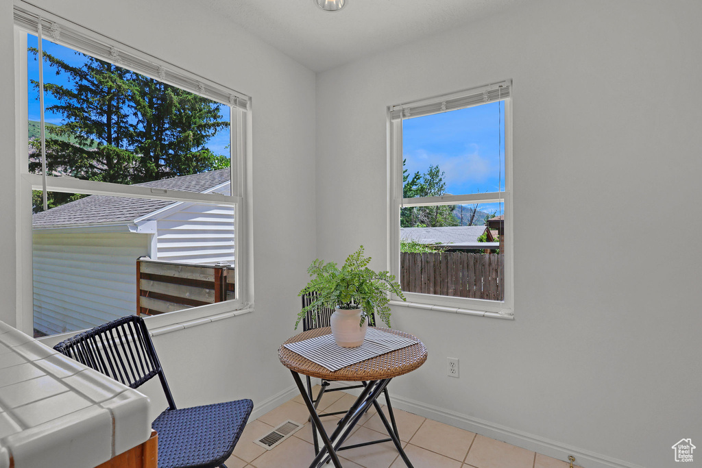 Sitting room featuring baseboards and light tile patterned floors