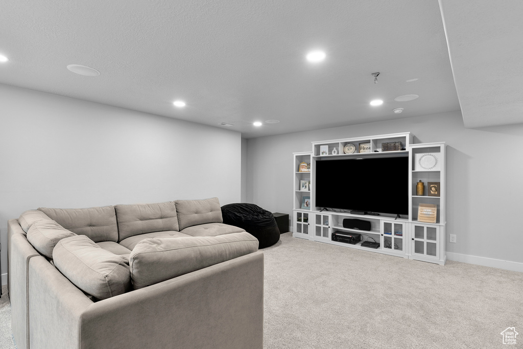 Living room with recessed lighting, carpet, and baseboards