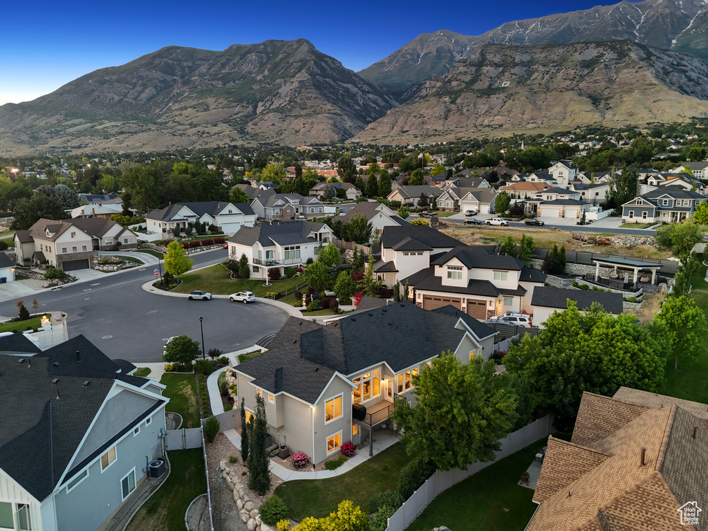 Aerial perspective of suburban area featuring a mountainous background