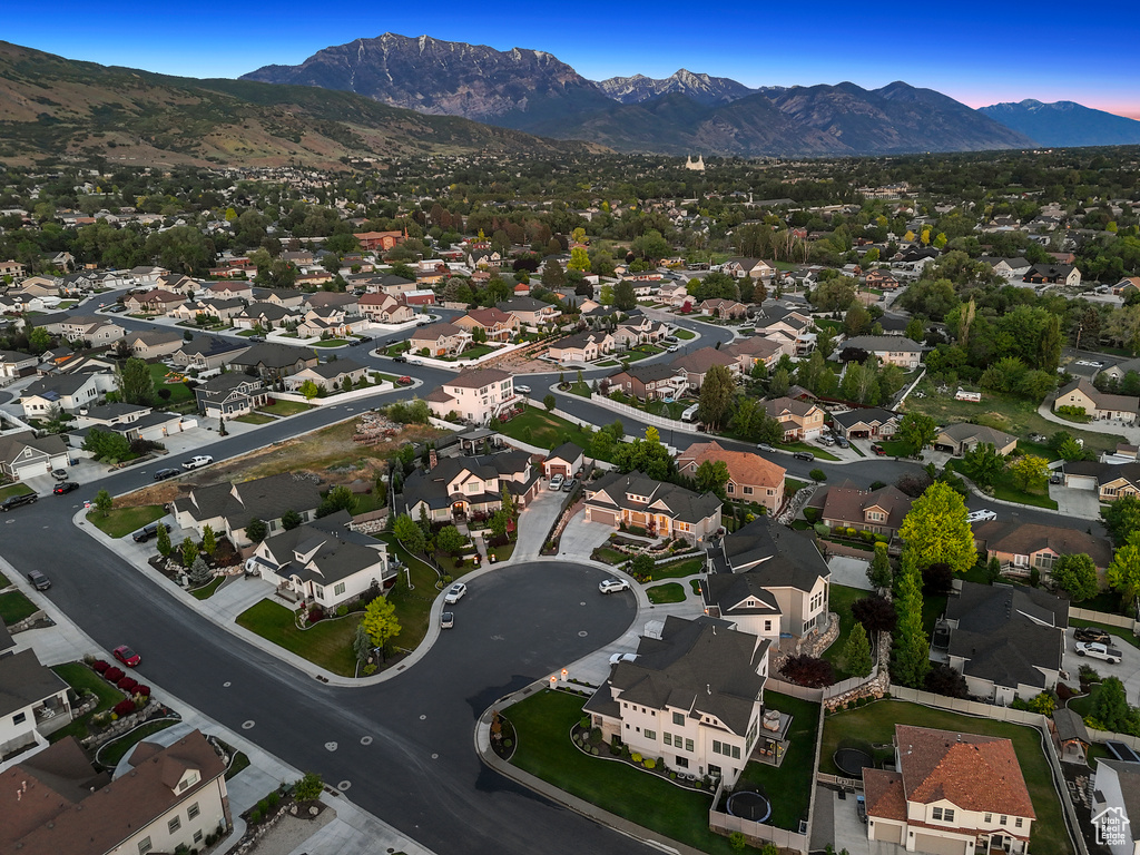 View of property location with a mountainous background and nearby suburban area