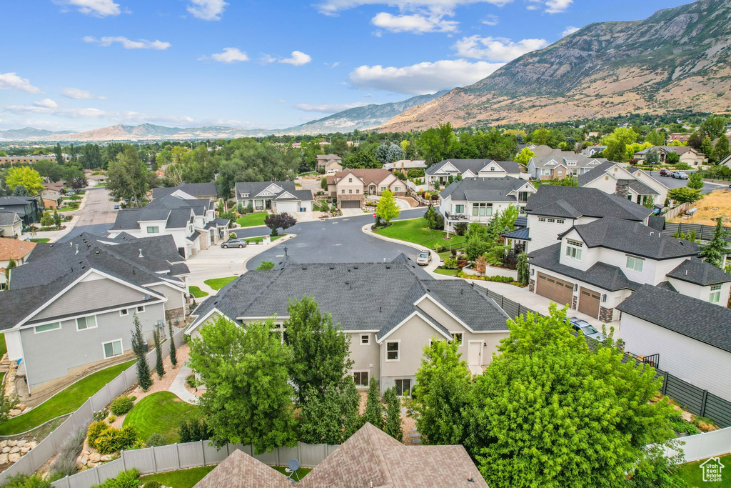 Aerial perspective of suburban area with a mountain backdrop