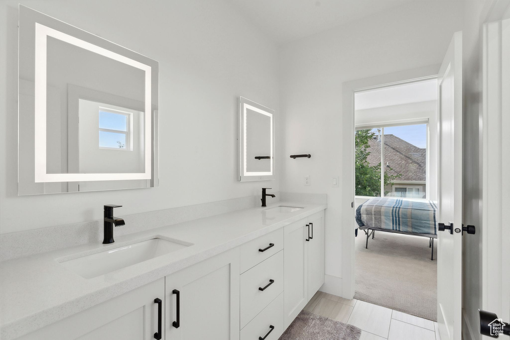 Bathroom with healthy amount of natural light and double vanity