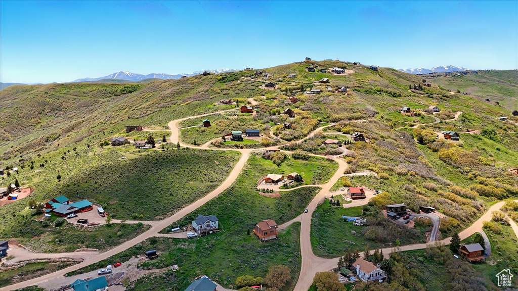 Aerial overview of property\\\'s location featuring a mountain backdrop