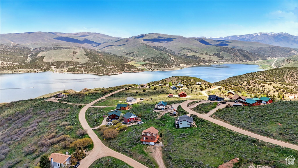 View of property location with a water and mountain view