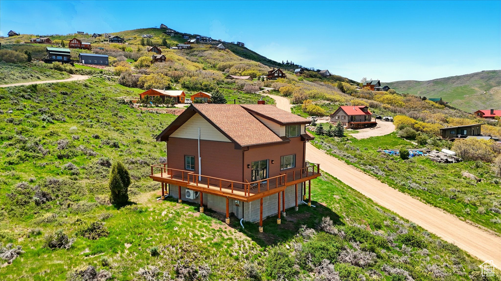 View from above of property featuring a mountainous background