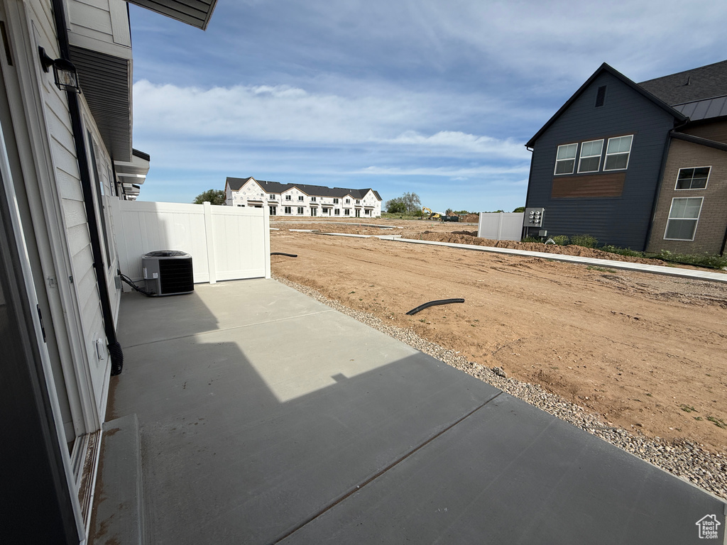 View of yard featuring a patio area and central air condition unit