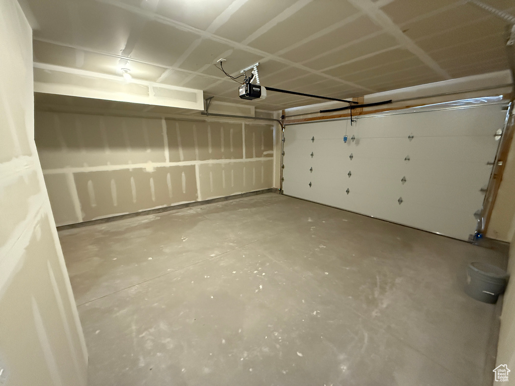Garage featuring a garage door opener