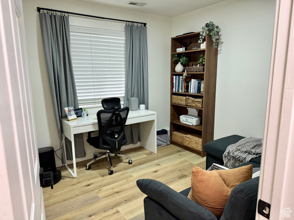 Office space featuring wood finished floors
