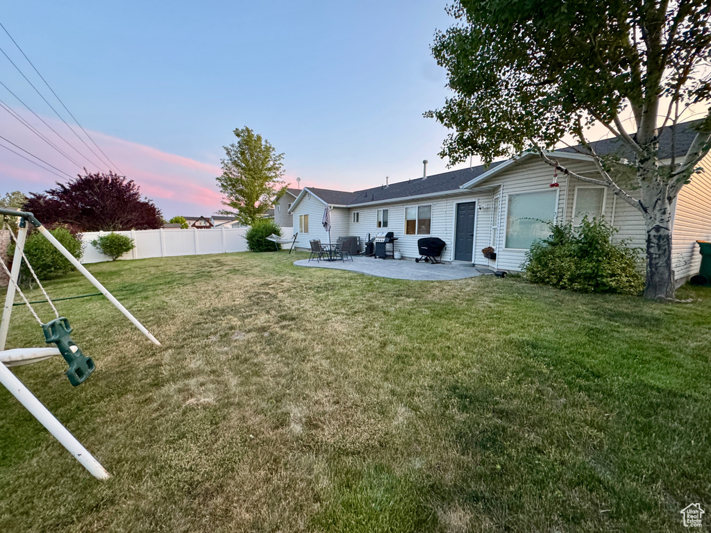 Yard at dusk with a patio
