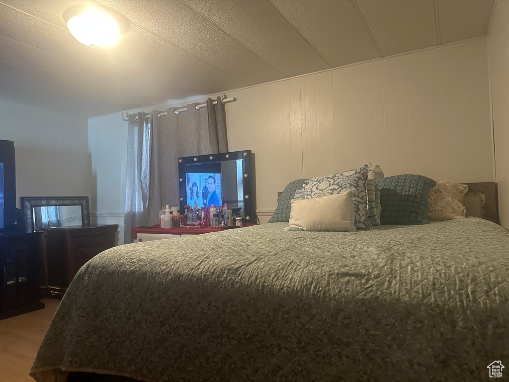Bedroom with wood finished floors