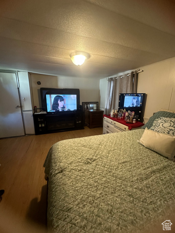 Bedroom with wood finished floors