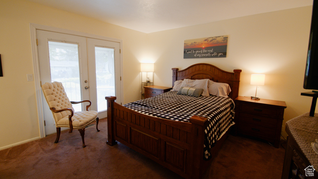 Bedroom featuring access to outside, carpet flooring, and baseboards