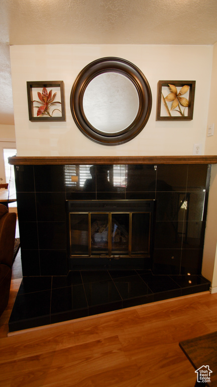Detailed view of wood finished floors and a textured ceiling