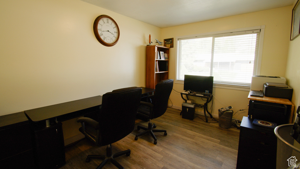 Office with wood finished floors