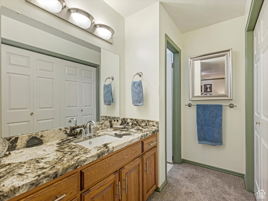 Bathroom featuring vanity and baseboards