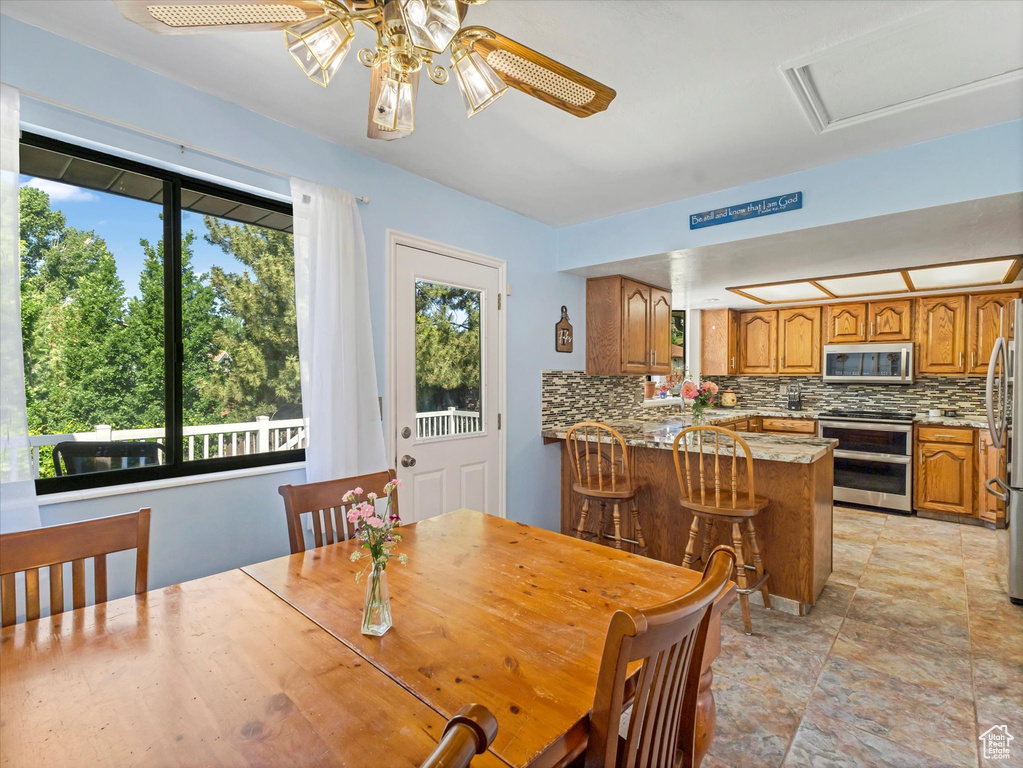 Dining room featuring a ceiling fan