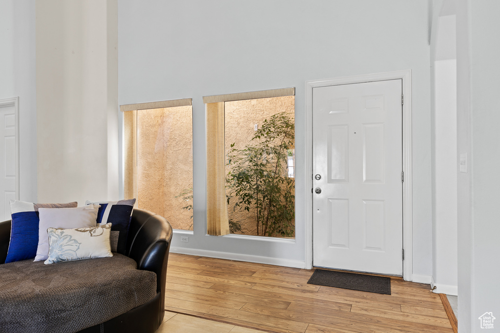 Entrance foyer featuring hardwood / wood-style floors and baseboards