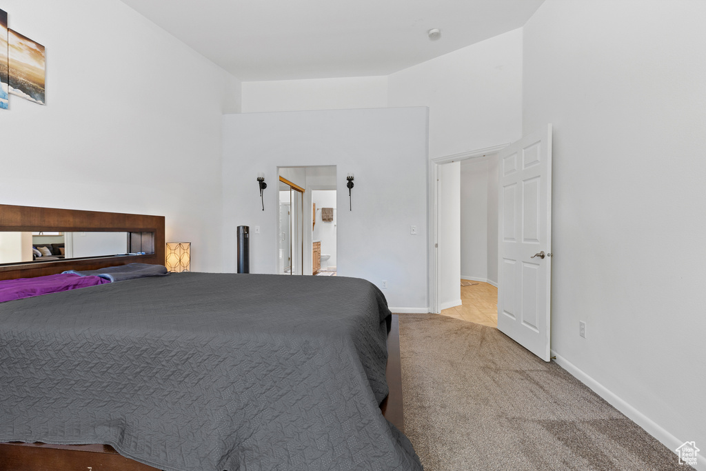 Carpeted bedroom featuring baseboards