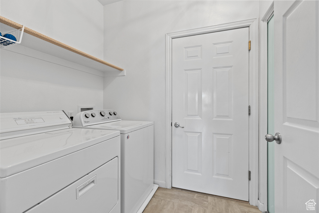 Laundry room featuring separate washer and dryer