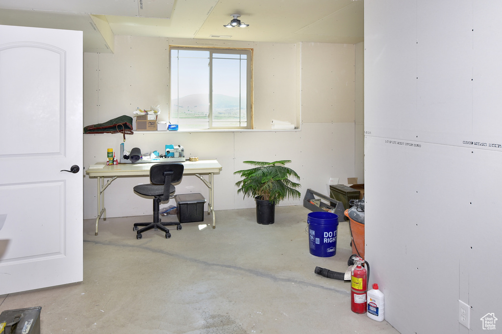 Office area featuring concrete floors