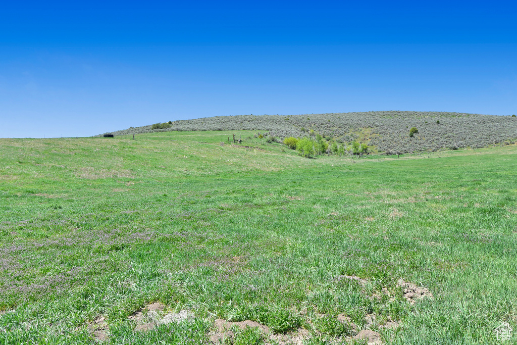 View of green lawn with a view of countryside