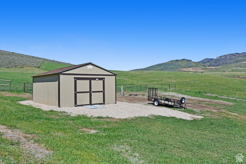 View of shed with a mountain view and a view of rural / pastoral area