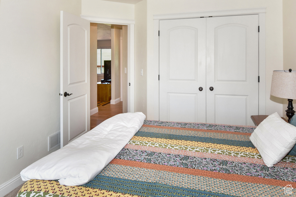 Bedroom with baseboards and a closet