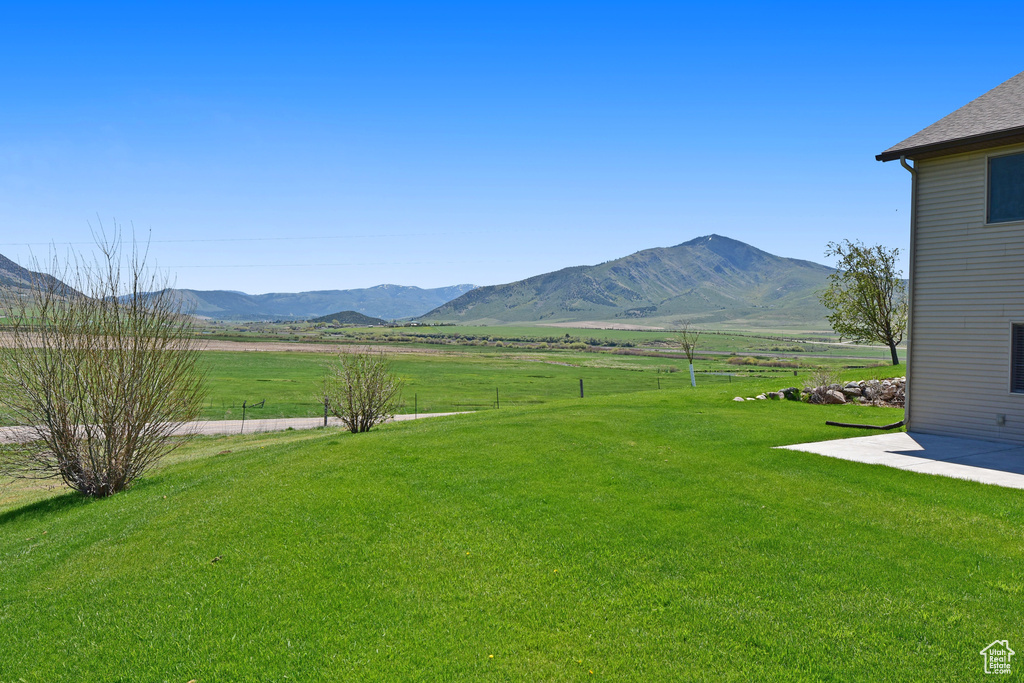 View of yard featuring a mountain view and a view of countryside