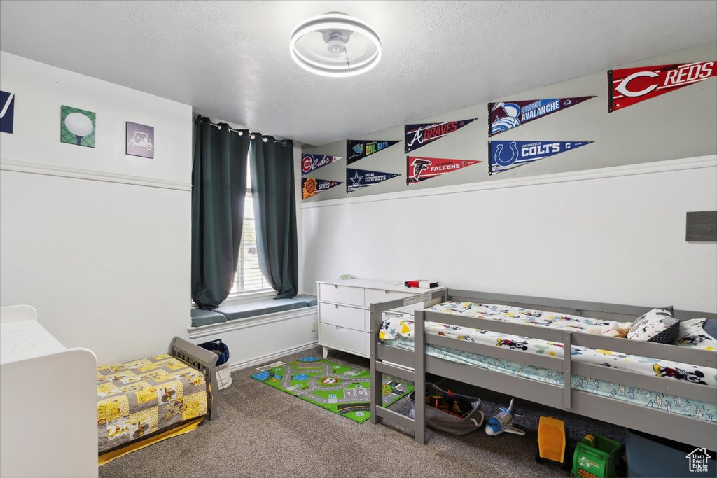 Bedroom featuring carpet