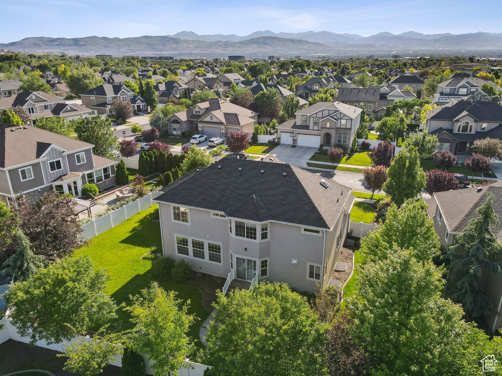 Aerial view of residential area featuring a mountain backdrop