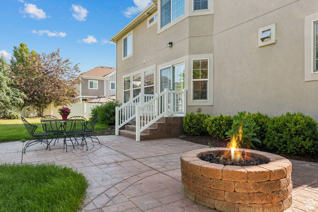 View of patio / terrace with a fire pit